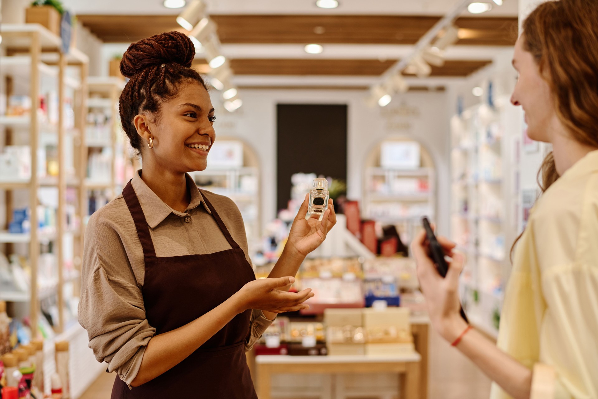 Saleswoman giving consultation to customer in store